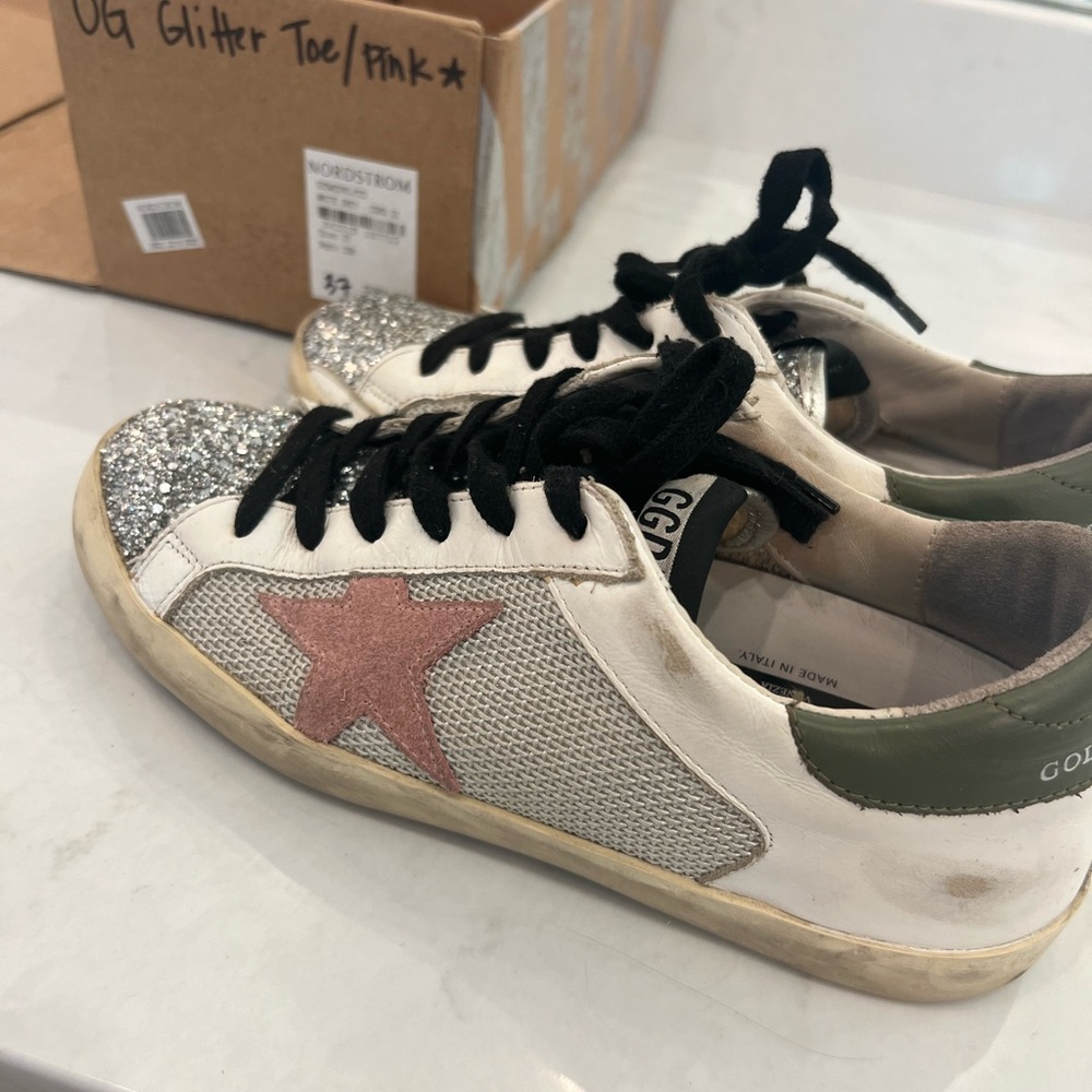 Golden goose, pink, green, black accents and silver. Sequins